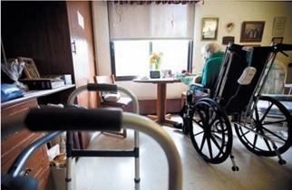 Image of an elderly lady in a wheelchair